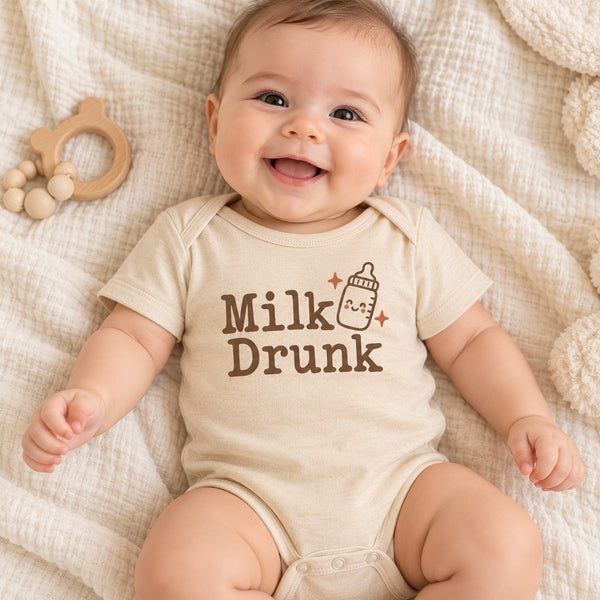Baby wearing the Milk Drunk baby bodysuit
