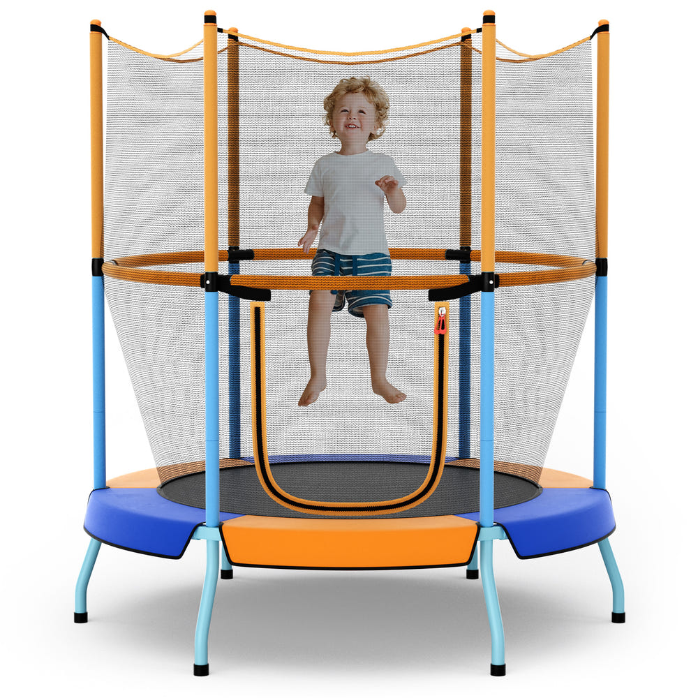 Child playing on a trampoline with safety net in a decorated living room.