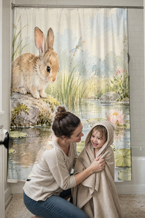 Mom drying her toddler in a hooded towel in front of the Quiet Garden Pond Bunny shower curtain