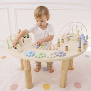 Wooden multi-activity sensory play table for babies, showcasing engaging features from angle 2.