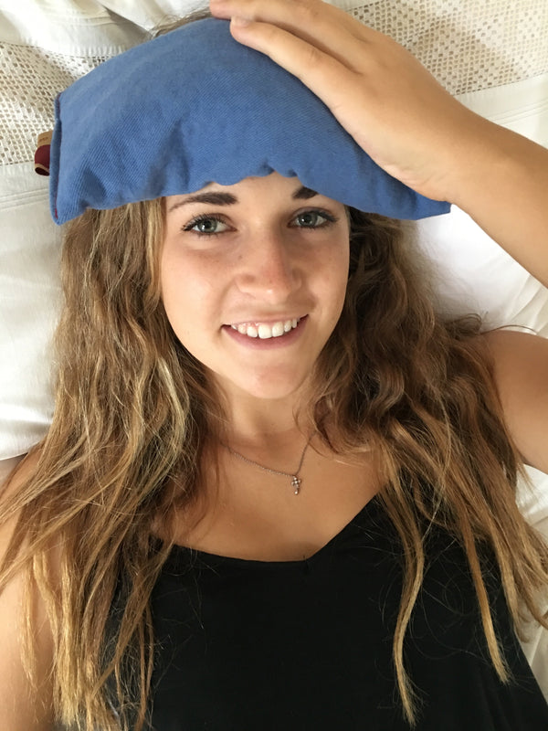 Cherry Ice® Blue Denim Eye Pillow in zip-close freezer bag, angled view showcasing design and packaging.