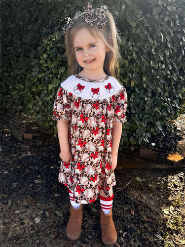 Smocked leopard baseball dress for babies, stylish and playful design for little ones.