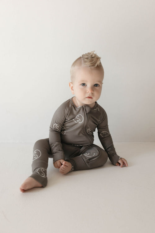 Bamboo zip pajamas in sage with yin yang design, showcasing angle 3 view for baby comfort and style.