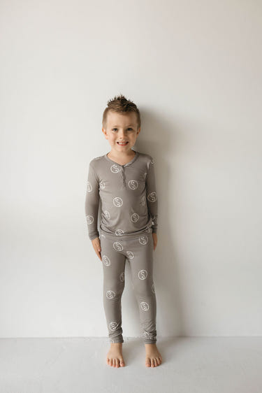 Bamboo two-piece pajamas in sage with yin yang design for babies, soft and stylish sleepwear.