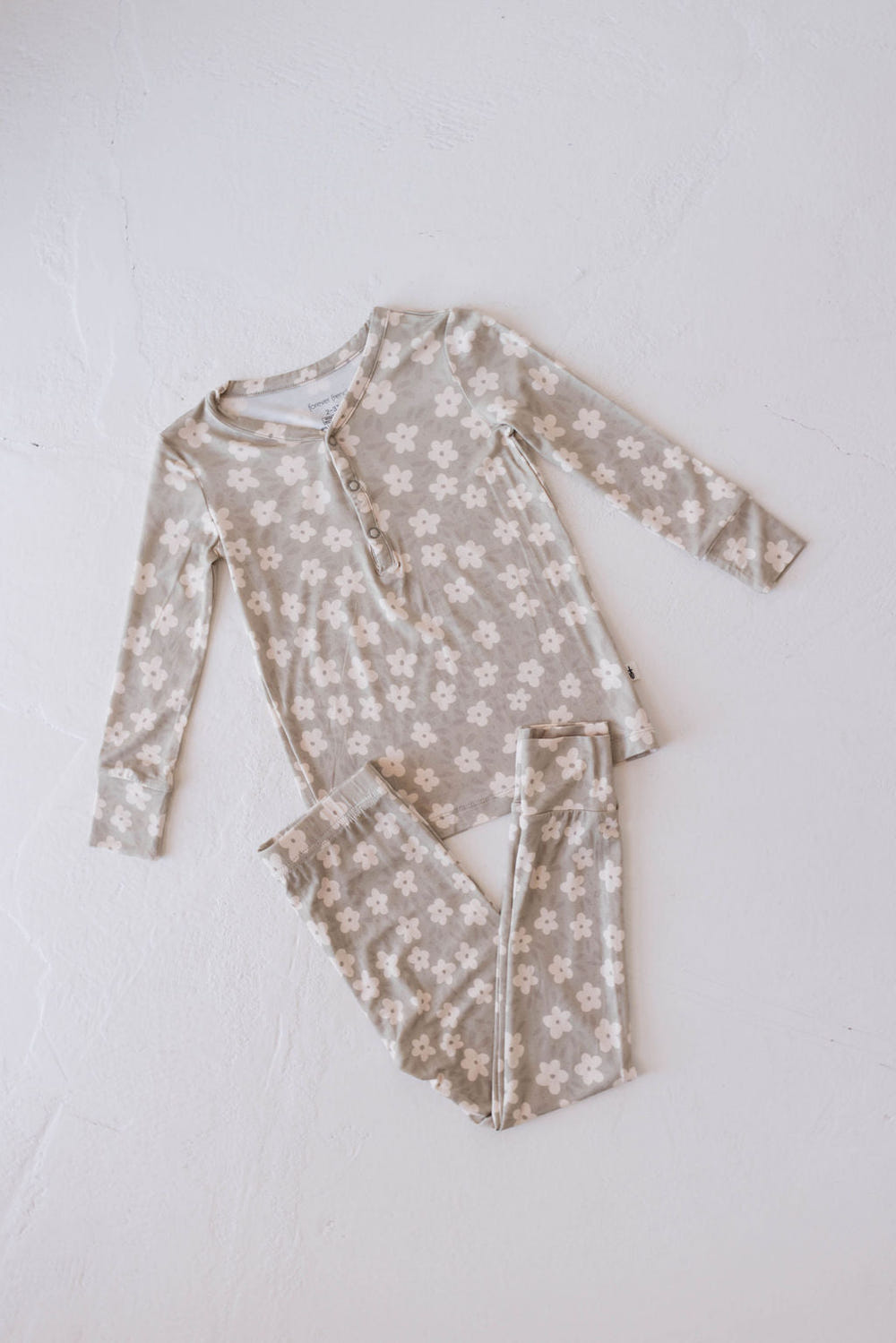Bamboo two-piece pajamas in French gray floral design for babies, perfect for comfortable sleep.