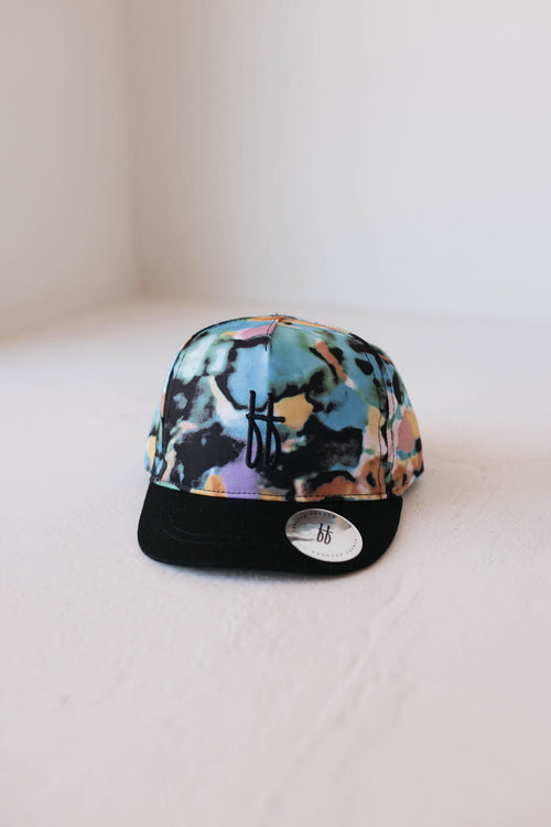 Children's trucker hat with Charli print, perfect for stylish little ones. Ideal for outdoor play and sun protection.