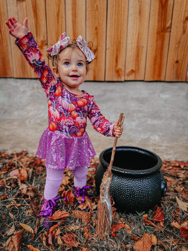 Purple pumpkin long sleeve mesh skirted romper for babies, stylish and comfortable clothing for little ones.