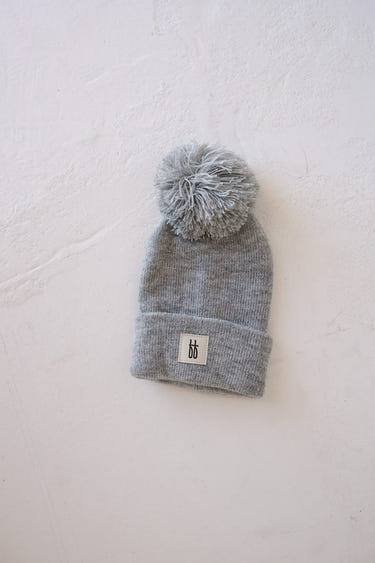 Grey ff Knit Pom Top Beanie for babies - stylish and cozy headwear for little ones.