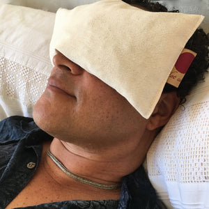 Hot Cherry Eye Pillow in unbleached natural denim, pre-washed, angled view showcasing its soft texture and design.