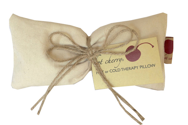 Hot Cherry Eye Pillow in unbleached natural denim, pre-washed, angled view showcasing its soft texture and design.