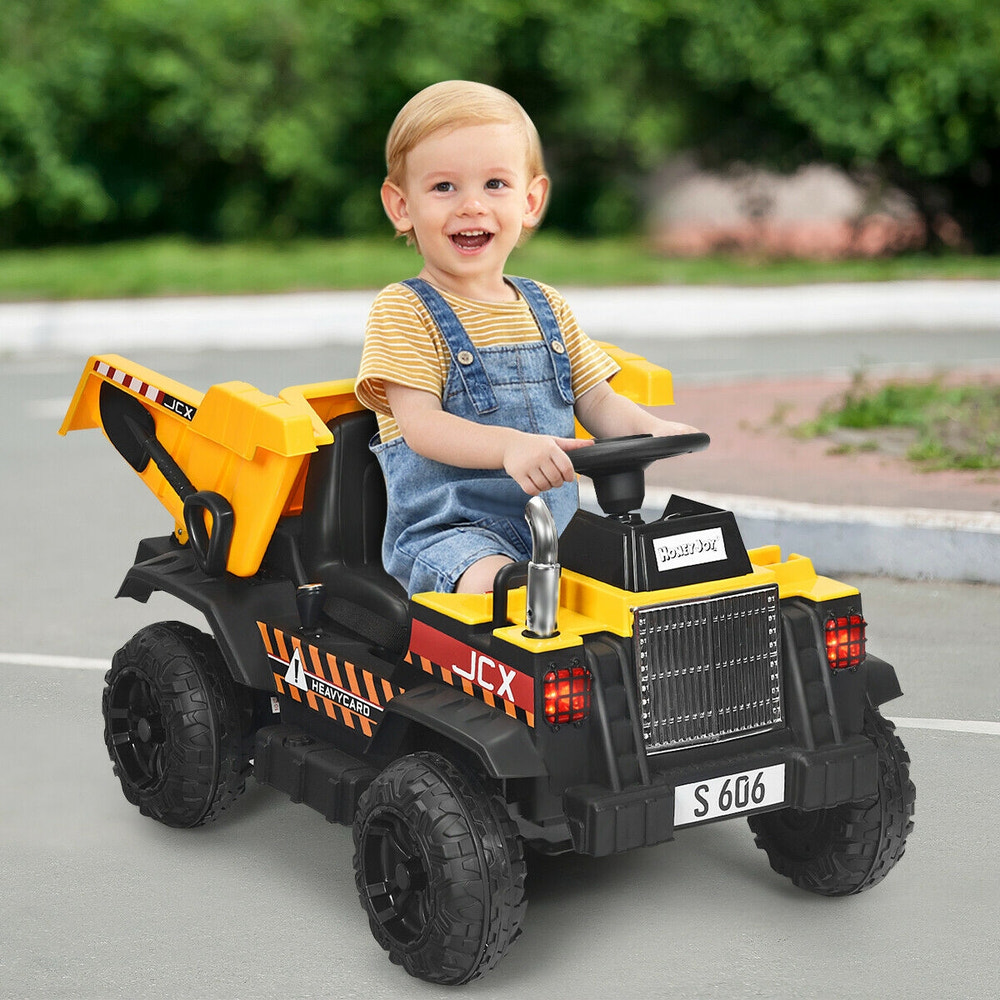 Yellow 12V battery kids ride-on dump truck with electric bucket and dump bed, perfect for outdoor play.