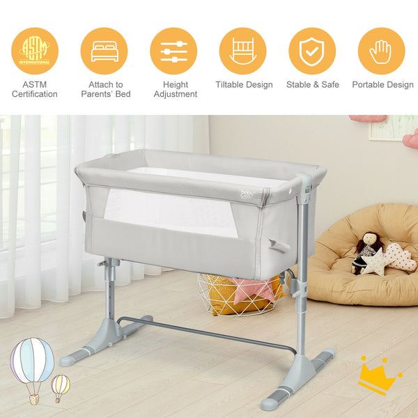 Portable baby bed side sleeper bassinet crib with carrying bag, perfect for travel and cozy sleep.