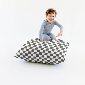 Checker Pepper Bean Bag for babies, offering comfort and style in a cozy seating solution.