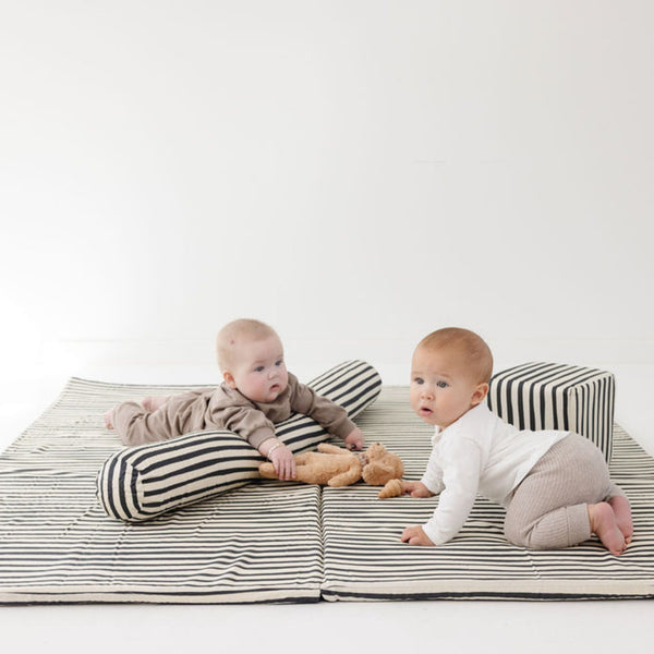 Bold Stripe Organic Cotton Mat for babies, featuring vibrant colors and a soft texture, perfect for playtime.