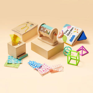 Tiny Land® Montessori Sensory Beginnings Baby Set for infants 0-6 months, featuring engaging textures and colors.
