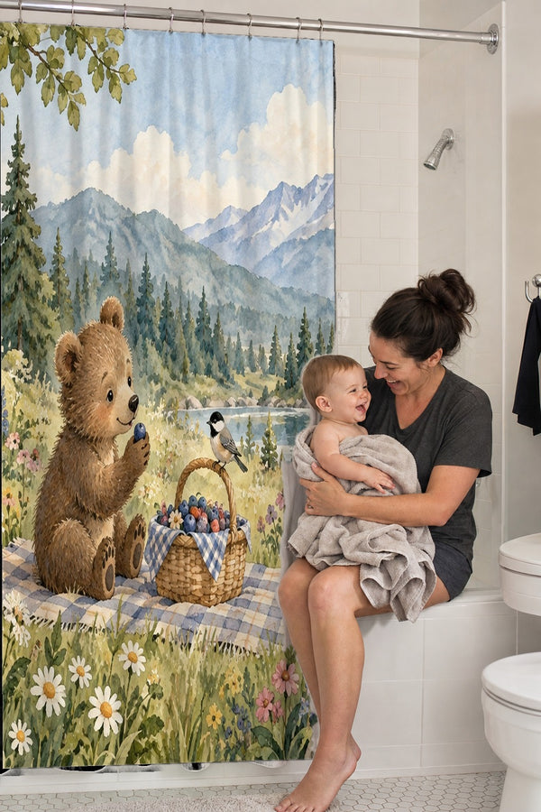 Mom holding her baby on the tub edge next to the Meadow Picnic Camping shower curtain