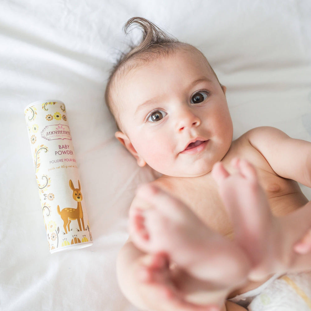 Talc-free organic herbal baby powder in eco-friendly packaging for gentle diaper care.