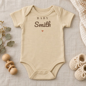 Baby Surname baby bodysuit in natural