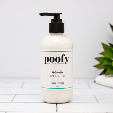 Naturally Unscented Shea Lotion for babies, gentle and nourishing body care in a sleek bottle.