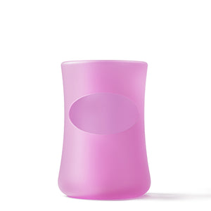 Mōmi silicone 4 oz glass bottle sleeves in various colors, angle 6 view showcasing durability and style for baby bottles.