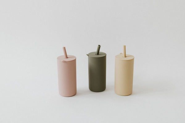 Colorful toddler cups with straw, angled view, perfect for little hands and easy sipping. Ideal for kids' drinkware.