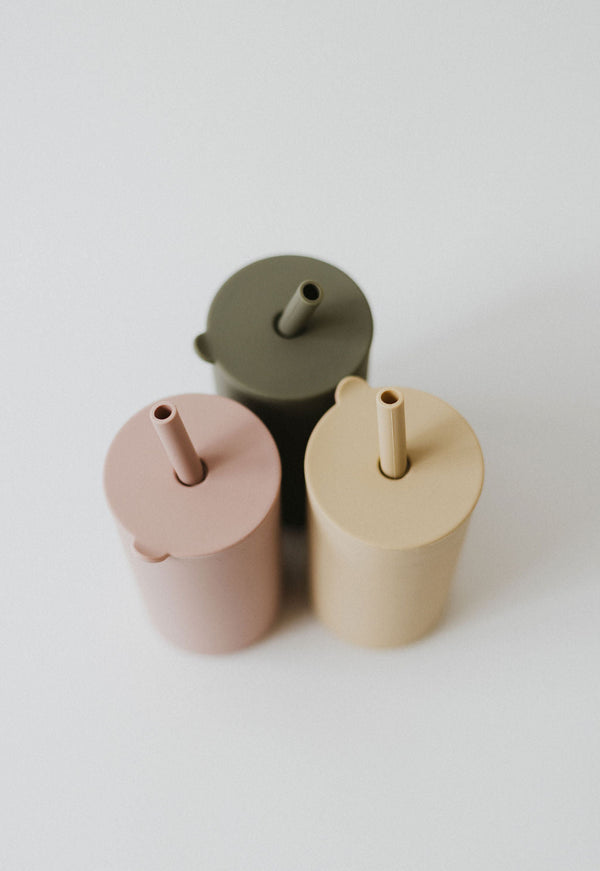 Colorful toddler cups with straw, angled view, perfect for little hands and spill-free sipping.