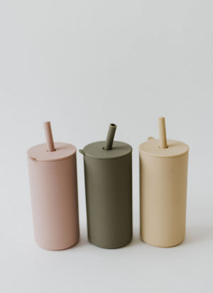 Colorful toddler cups with straws, angled view, perfect for little ones learning to drink independently.