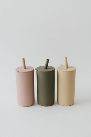 Colorful toddler cups with straws, angled view, perfect for little hands and easy sipping. Ideal for kids' drinkware.