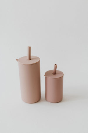 Colorful toddler cups with straws, perfect for little hands and spill-free sipping.