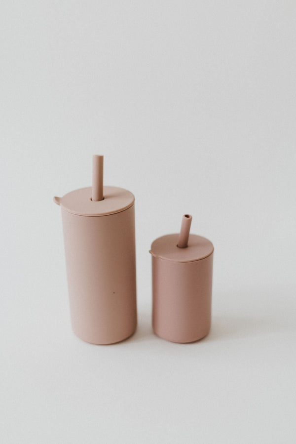 Colorful toddler cups with straws, perfect for little hands and spill-free sipping.