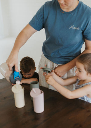 Colorful toddler cups with straws, perfect for little hands, displayed at an angle for a fun view.