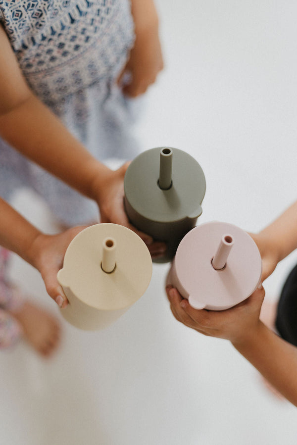 Colorful toddler cups with straws at a 20-degree angle, perfect for little hands and spill-free sipping.