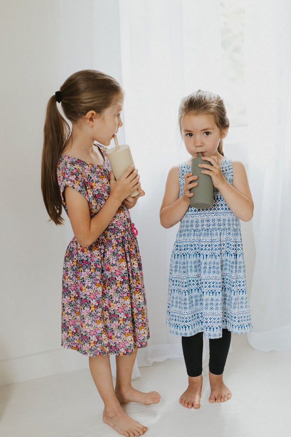 Colorful toddler cups with straws, perfect for little hands, displayed at an angle for a stylish view.