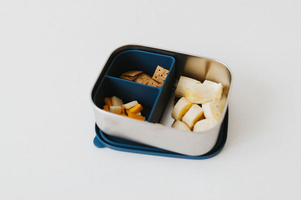 Stainless steel and silicone bento box for babies, perfect for food storage and on-the-go meals.