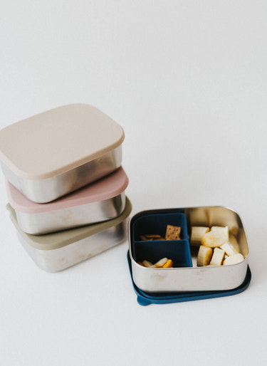 Stainless steel and silicone bento box for babies, perfect for food storage and on-the-go meals.