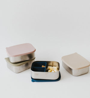 Stainless steel and silicone bento box for babies, perfect for food storage and on-the-go meals.