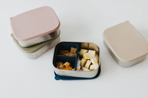 Stainless steel and silicone bento box for babies, perfect for food storage and on-the-go meals.