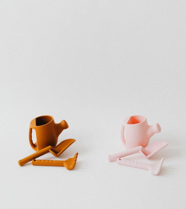 Silicone watering can set for babies, perfect beach toy for sand play and outdoor fun. Angle 5 view.