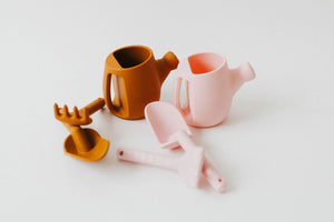 Colorful silicone watering can set for babies, perfect for sand and beach play. Angle 7 view showcasing vibrant design.