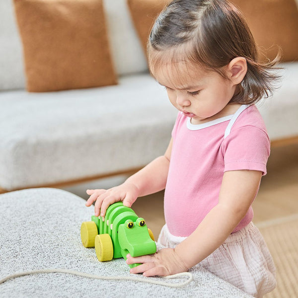 Dancing Alligator baby hat, socks, and mittens set in playful design, angle view showcasing vibrant colors and fun patterns.
