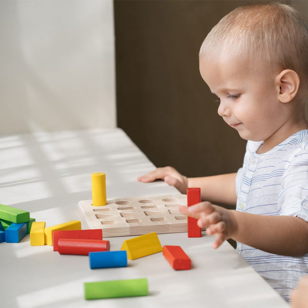 Geometric peg board for babies, promoting early learning and sensory play, shown from angle 2.