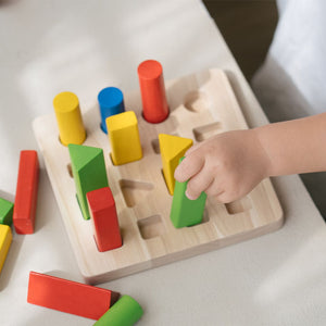 Geometric peg board for babies, promoting early learning and sensory play, shown from angle 4.