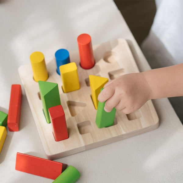 Geometric peg board for babies, promoting early learning and sensory play, shown from angle 4.