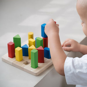 Geometric peg board for babies, promoting early learning and sensory play, shown at angle 5.