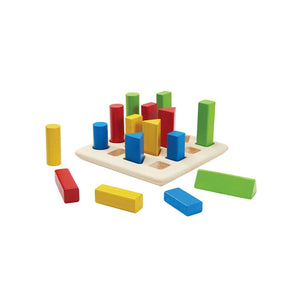 Colorful geometric peg board for babies, promoting early learning and sensory play at an engaging angle.