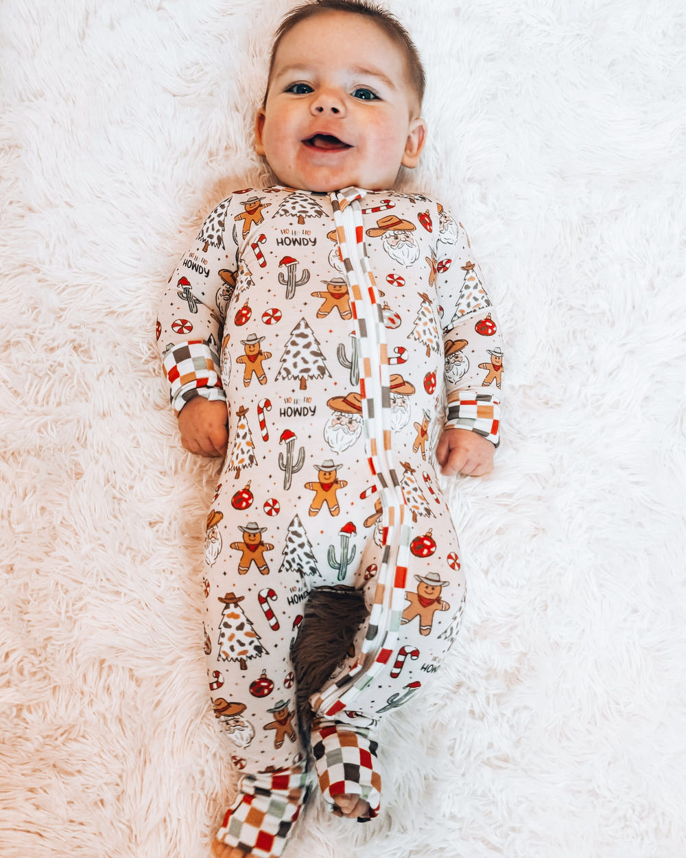 Cowboy Christmas bamboo zip sleeper for babies, 220 GSM, true to size, perfect for cozy holiday nights.