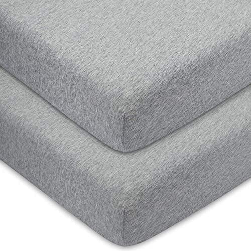 Grey crib sheets displayed at an angle, perfect for a stylish and cozy nursery.
