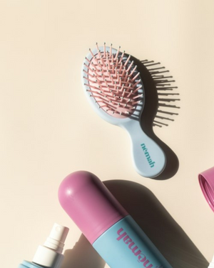 Kids detangling brush for gentle hair care, designed for babies and toddlers, shown from angle 3.