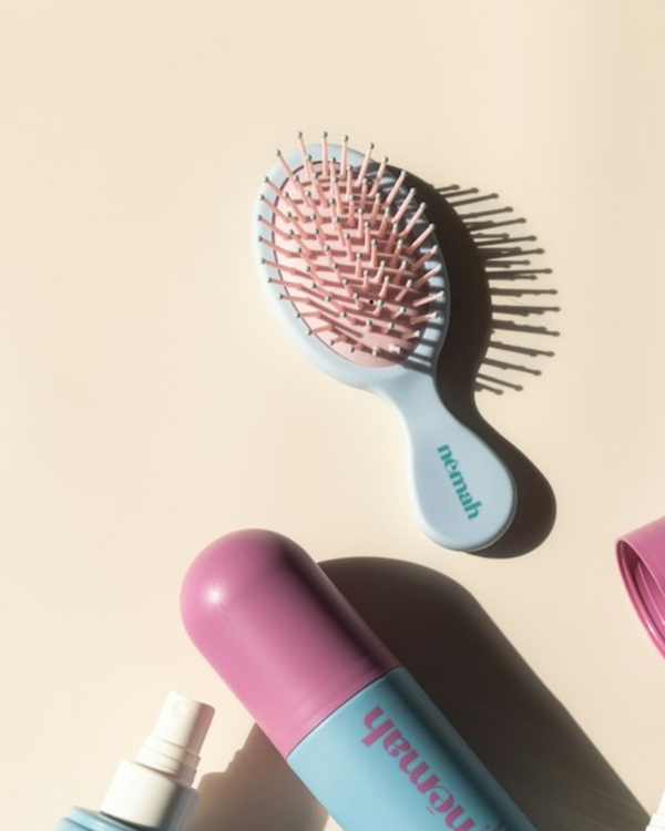 Kids detangling brush for gentle hair care, designed for babies and toddlers, shown from angle 3.