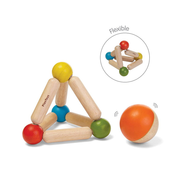Colorful triangle clutching toy for babies, promoting sensory play and motor skills development.
